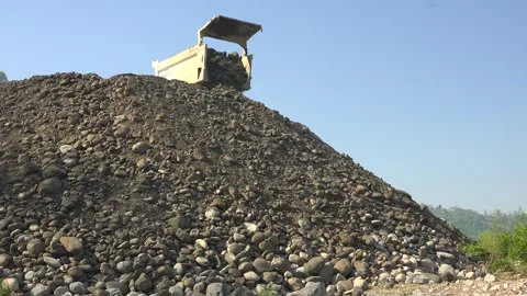 Dump truck unloads sand - Construction Machinery and Building Materials Stock Footage 339814250