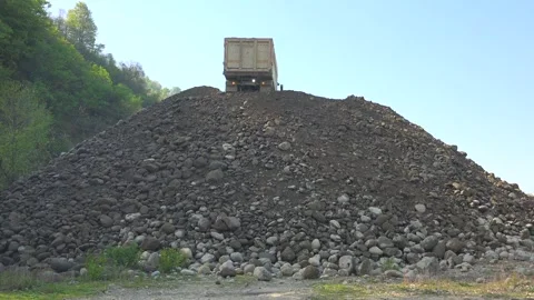 Dump truck unloads sand - Construction Machinery and Industrial Vehicle Stock Footage 339814306