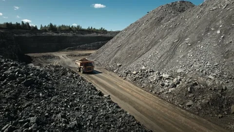 Dump truck working at mining site. Loaded with precious minerals in an open pit. Video stock 205314764