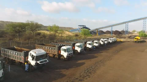 Dump Trucks and Coal Conveyor Belt at Mining Site Stock Footage 338160955