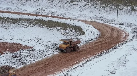 Dump Trucks carry ore. Winter Stock Footage 63545267