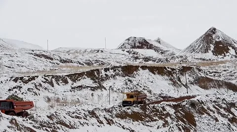 Dump Trucks carry ore. Winter Stock Footage 63545297