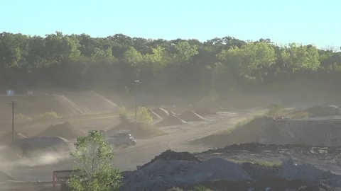 Dump Trucks Drive Through Dusty Quarry Stock Footage 81797066