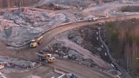 Dump trucks driving at crushed stone production site in Finland Stock Footage 338267206