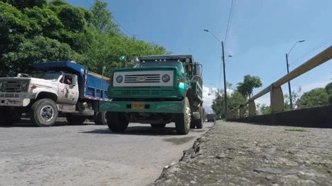 Dump trucks driving down a street - Old dumper trucks, Tipper truck Stock-Footage 154269913