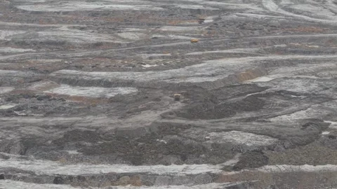 Dump trucks going back and forth transporting coal in a large mining area Stock Footage 332599567