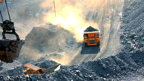 A dump trucks with iron ore drives through the quarry. Quarry dump trucks inside Stockbeeldmateriaal 161346799