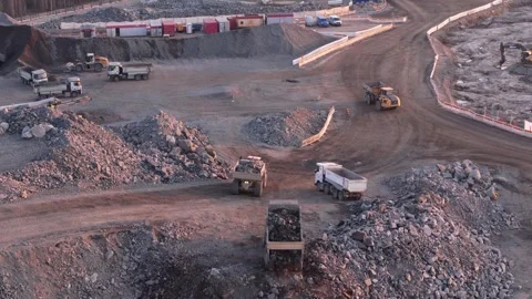 Dump trucks loading crushed stone in Finland construction site Stock Footage 324684832