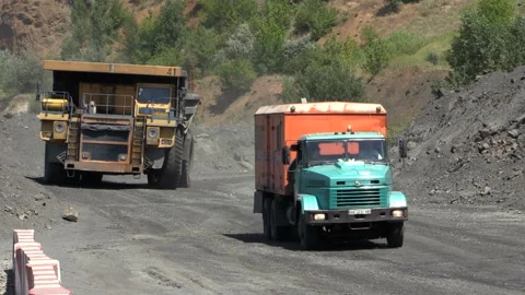 Dump trucks in open cast mine Stock Footage 131418257