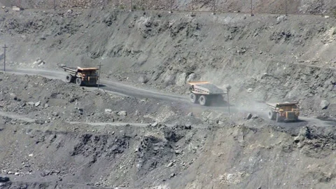 Dump trucks in open cast mine Stock Footage 131418542