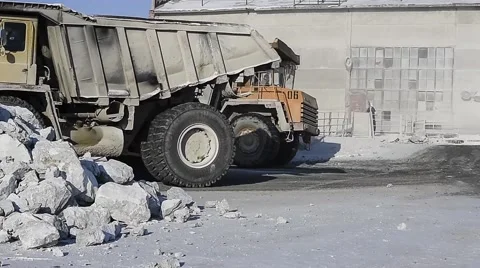 Dump trucks unload limestone. Stock-Footage 63545500