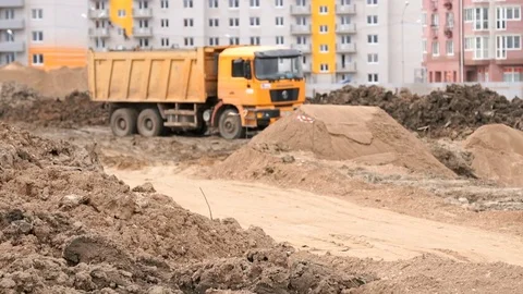 Dump trucks working on a construction site Stock Footage 78315974