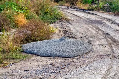 Dumped excess concrete on roadside Stockfoto's