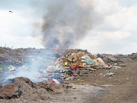 Dumped garbage burns Stock Photos