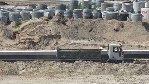 Dumper Trucks Moving Dirt on Construction Site Stock Footage 242572240