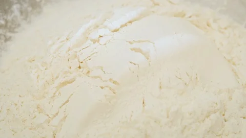 Dumping Bread Flour into a Bowl Stock Footage 129534876