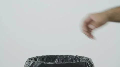 Dumping hand towel into the trash. Overflowing wet wipes in garbage bin. junk, F 库存影片 144660974