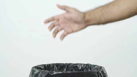 Dumping plastic bottle into the trash. Overflowing empty bottle in garbage bin.  Stock Footage 144660894