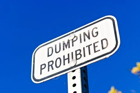Dumping Prohibited Warning Sign Against Blue Sky in Yorba Linda Stock Photos