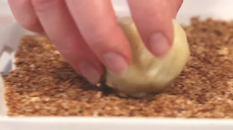 A dumpling being rolled in breadcrumbs Video stock 24673340
