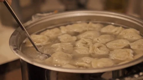 Dumpling cooking in boiling water. Meat Dumplings Stock Footage 82859810
