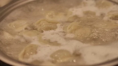 Dumpling cooking in boiling water. Meat Dumplings Stock Footage 82860185