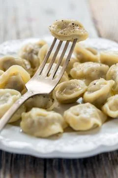 Dumpling on a fork. Stock Photos