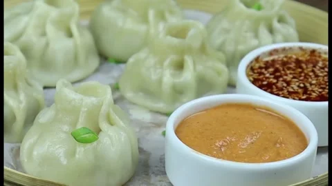 Dumpling Momo&amp;#039;s Served Hot, Steamed Momo Street Food Dish for Asian Cuisine Stock Footage 327012208