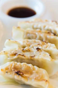 Dumpling on white dish on wood table Stock Photos