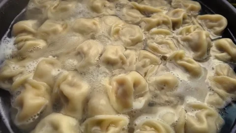 Dumplings are boiled in a deep pan Video stock 313431183