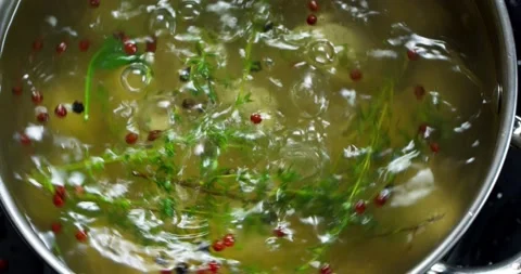 Dumplings are boiled in pot with boiling water with spices and spin Stock Footage 152093435
