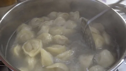 Dumplings are cooked in a saucepan Stock Footage 85881202