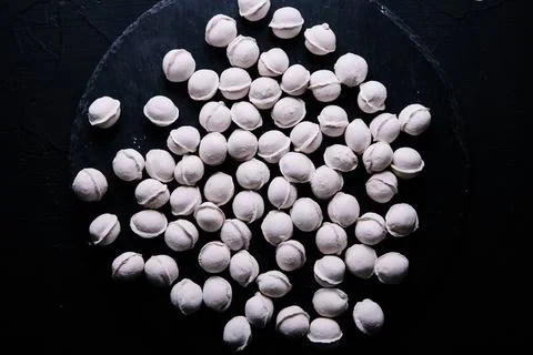 Dumplings background on black background Stock Photos