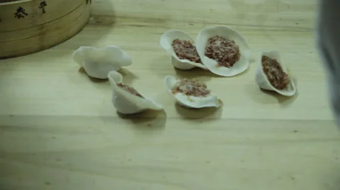 Dumplings being hand made in Beijing, China. 5 Stock Footage 5162640