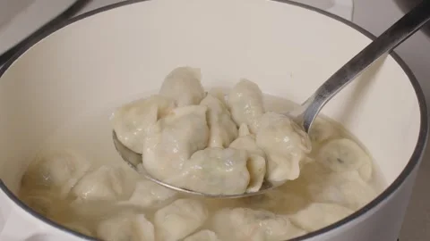 Dumplings Boiling and Serving in White Pot on Kitchen Counter Video stock 336522195
