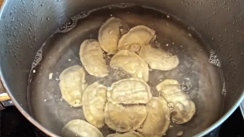 Dumplings Boiling in Pot of Water During Meal Preparation Video stock 337386069