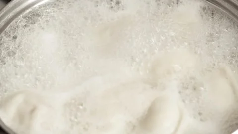 Dumplings cooked in boiling water, close-up Stock Footage 281774832
