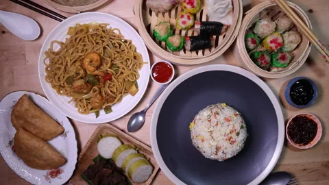 Dumplings dim sum bamboo steamer egg fried rice pulut lemang beef rendang stair  Stock Footage 155284028