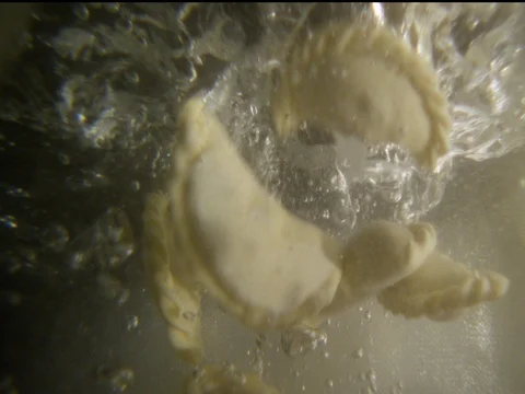 Dumplings fall into the water the view from under the water 1 Stock Footage 71344157