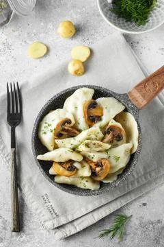 Dumplings, filled with mashed potatoes and mushrooms. Russian, Ukrainian or P Stock Photos
