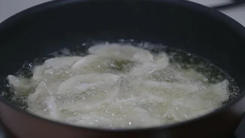 Dumplings fried in oil. Stock Footage 167237797