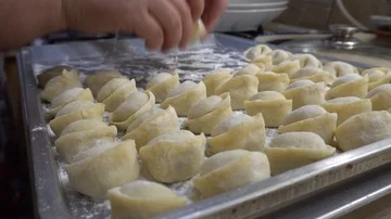 Dumplings lie on the baking tray in rows. Stock Footage 85880971