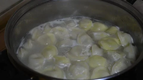 Dumplings with meat in boiling water for lunch. Stock Footage 132084834