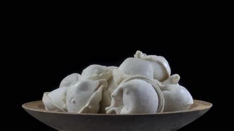 Dumplings on a plate rotate in 4K Stock Footage 148097522