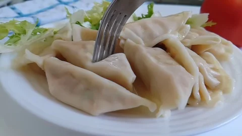 Dumplings on a plate slow motion Stock Footage 89711095