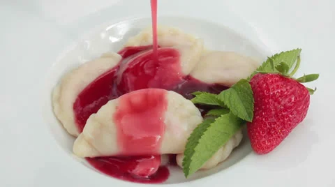 Dumplings with strawberries. Stock Footage 24333938
