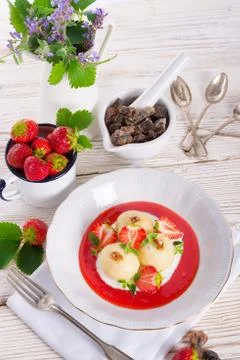 Dumplings with strawberries Stock Photos