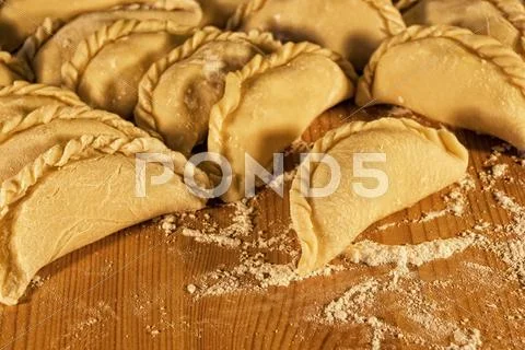 Dumplings on the table with flour Stock Photos