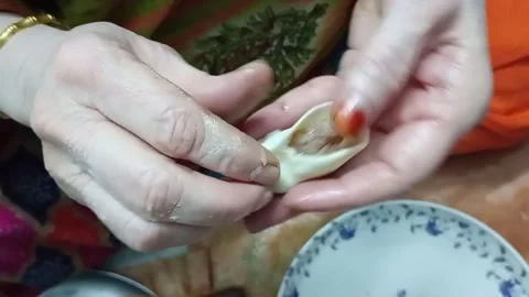 Dumplings wrapper pleating of Momo, a Tibetan and Nepali cuisine Stock Footage 274091041