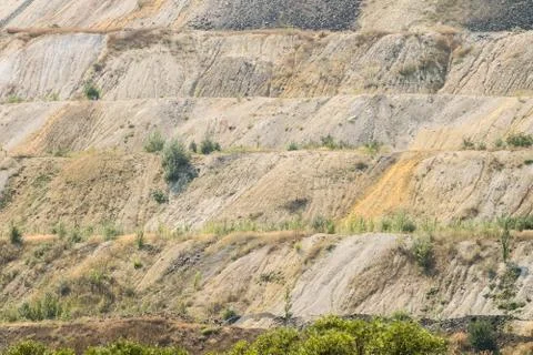 Dumps of processed iron ore. Waste from the iron ore industry. Close-up. Stock Photos